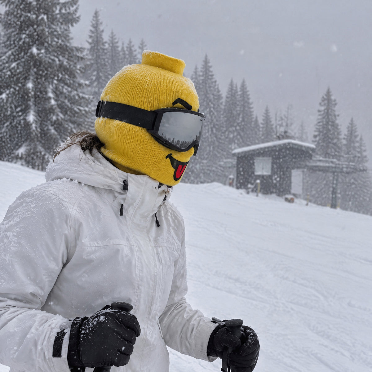 Tongue Out mask worn by a skier with goggles down